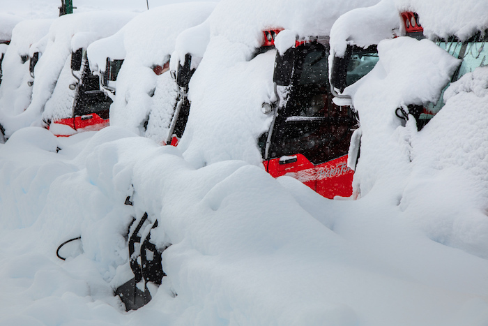 Snowcats covered in October snow on Whistler