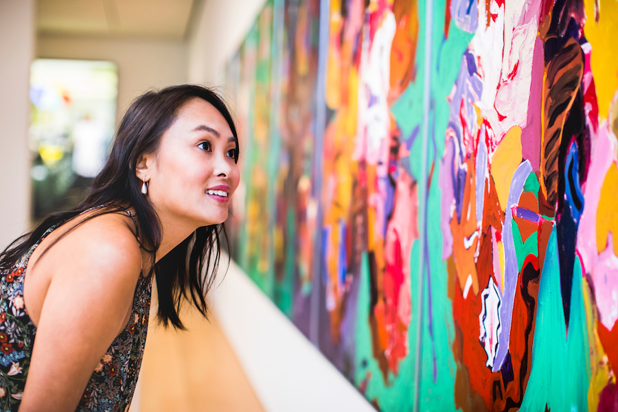 A woman looks at a piece of art in the Audain Museum