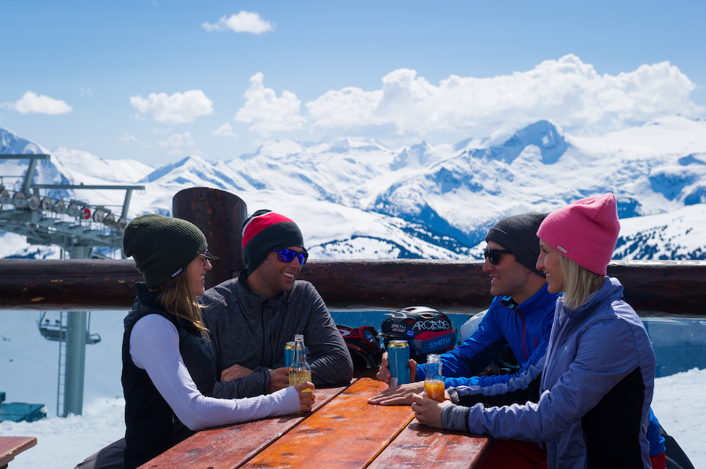 Friends gather to eat on the mountain