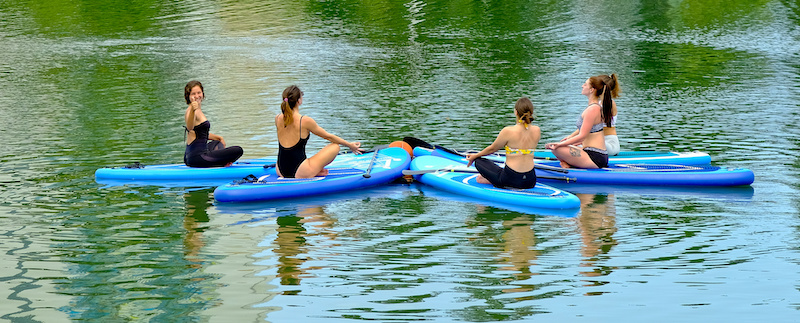 Group of women paddleboarding in Whistler