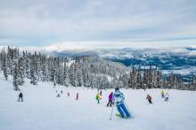 Colorful skiers on Whistler in the spring